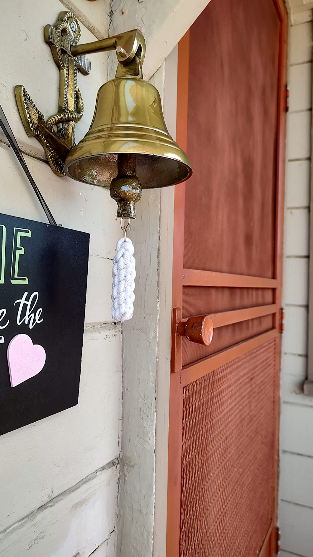 A Ship's Bell Gives Your Front Door a Nautical Vibe